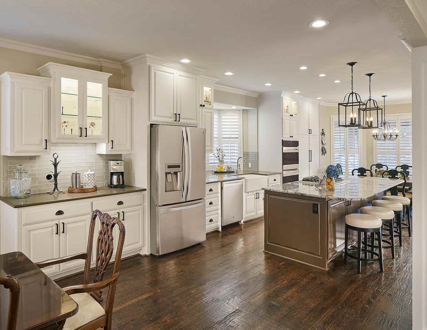 Transitional Kitchen remodel in Plano, TX. Features custom shaker style cabinetry with full beverage center.
